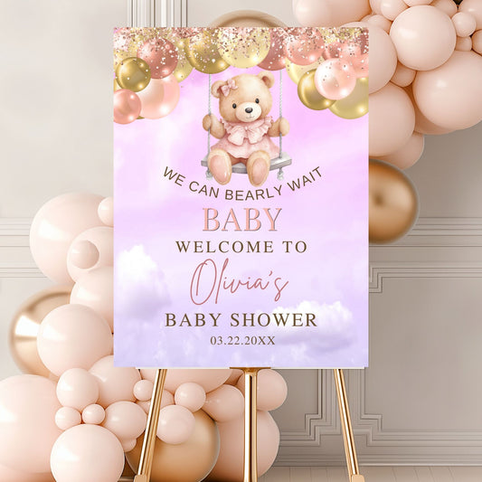Baby shower sign with teddy bear graphic and balloons in the background