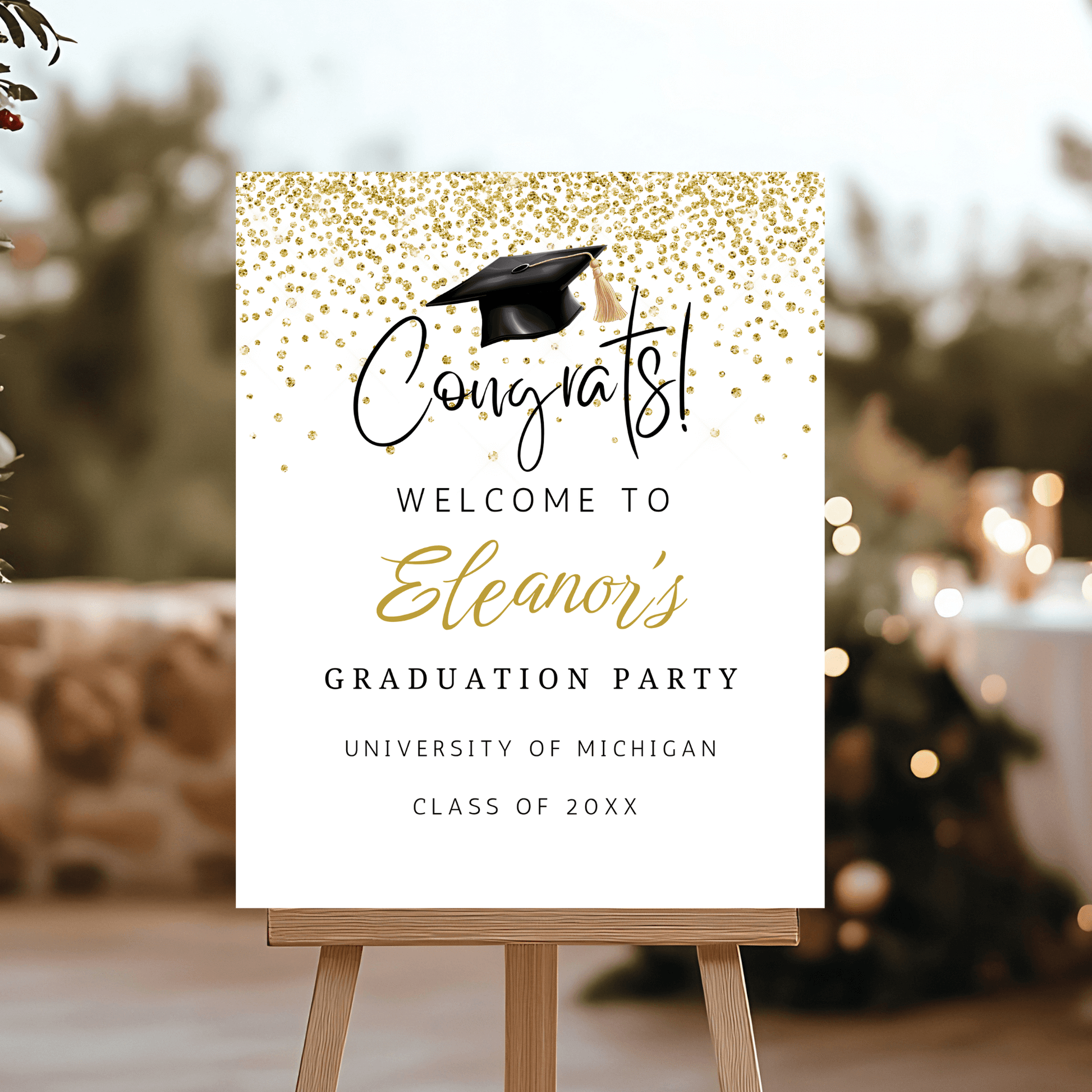 gold graduation welcome sign with cap