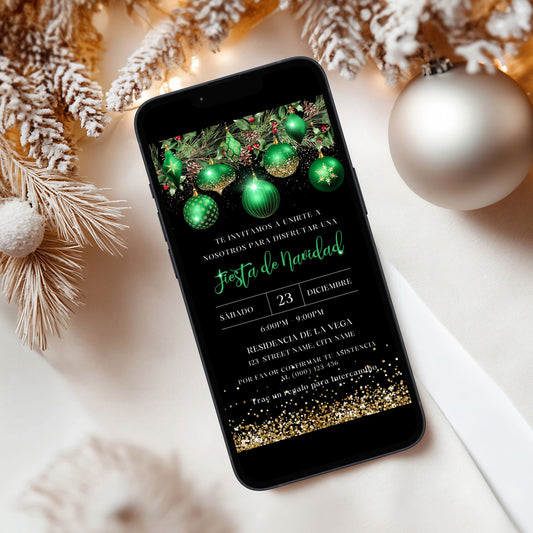 Phone displaying a Spanish Green Ornaments Christmas invitation with festive decorations on a white surface.