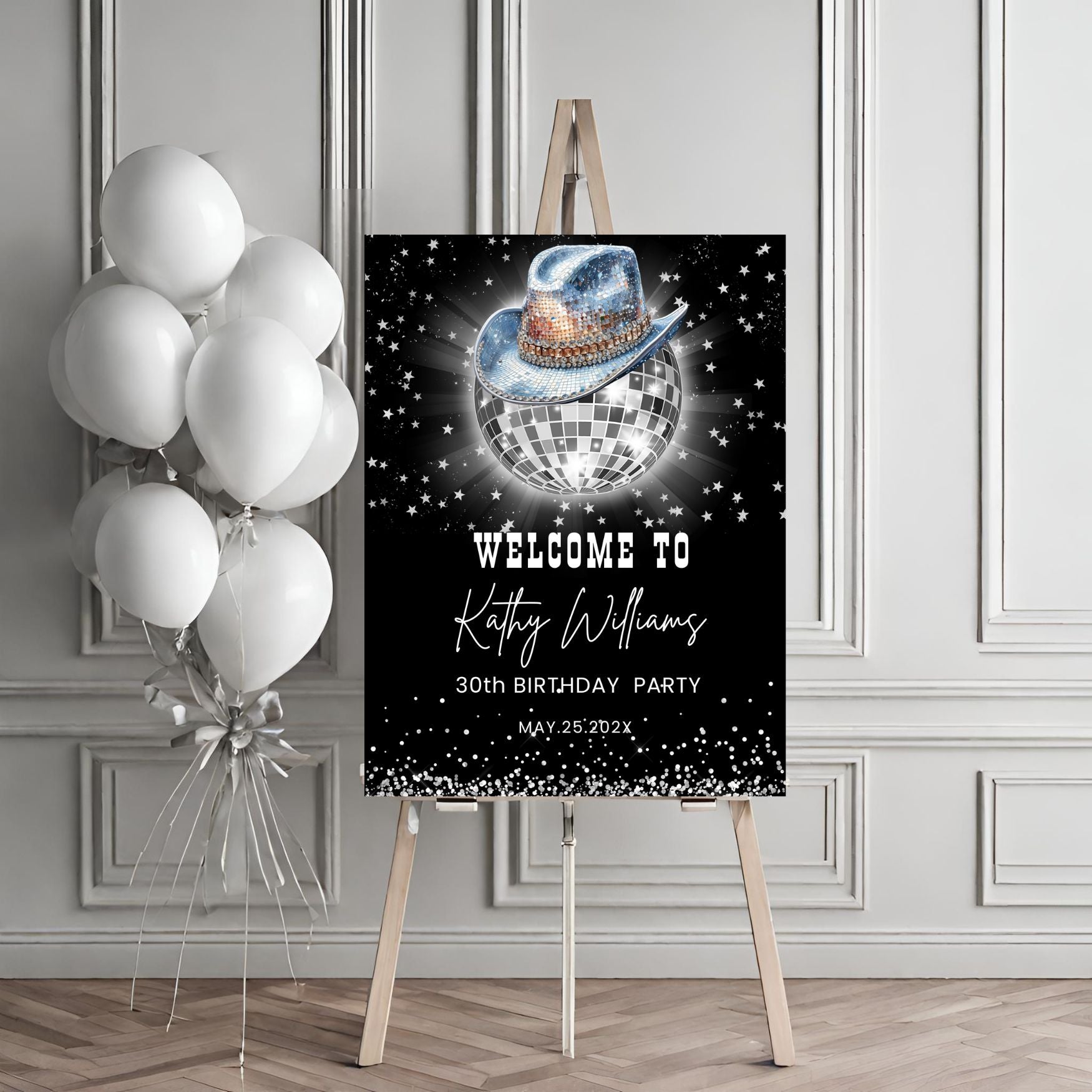 Birthday party sign with disco ball and cowboy hat design, accompanied by balloons on an easel.