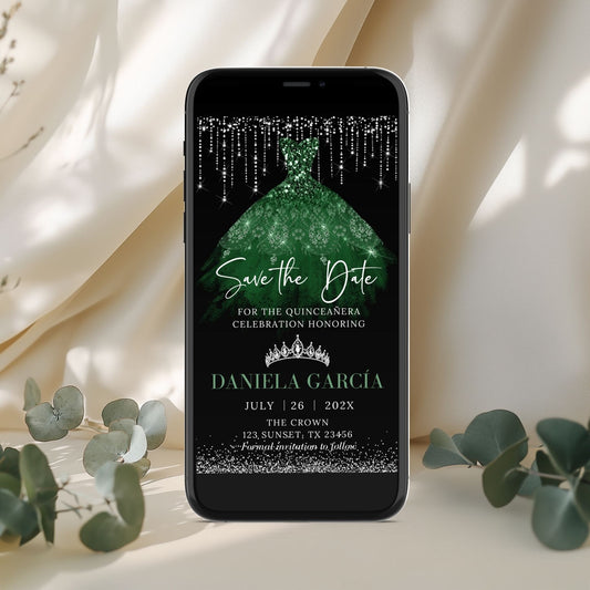 Phone displaying a green dress save the date invitation with text on a light background