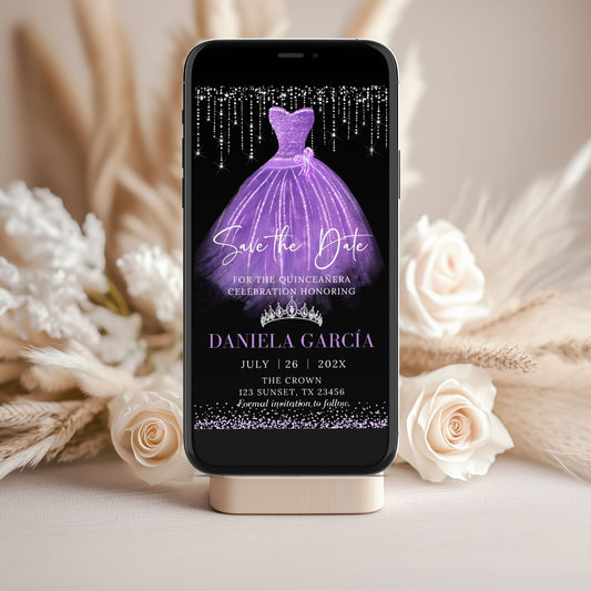 Phone displaying a purple dress annd silver invitation with text on a decorative stand with flowers.
