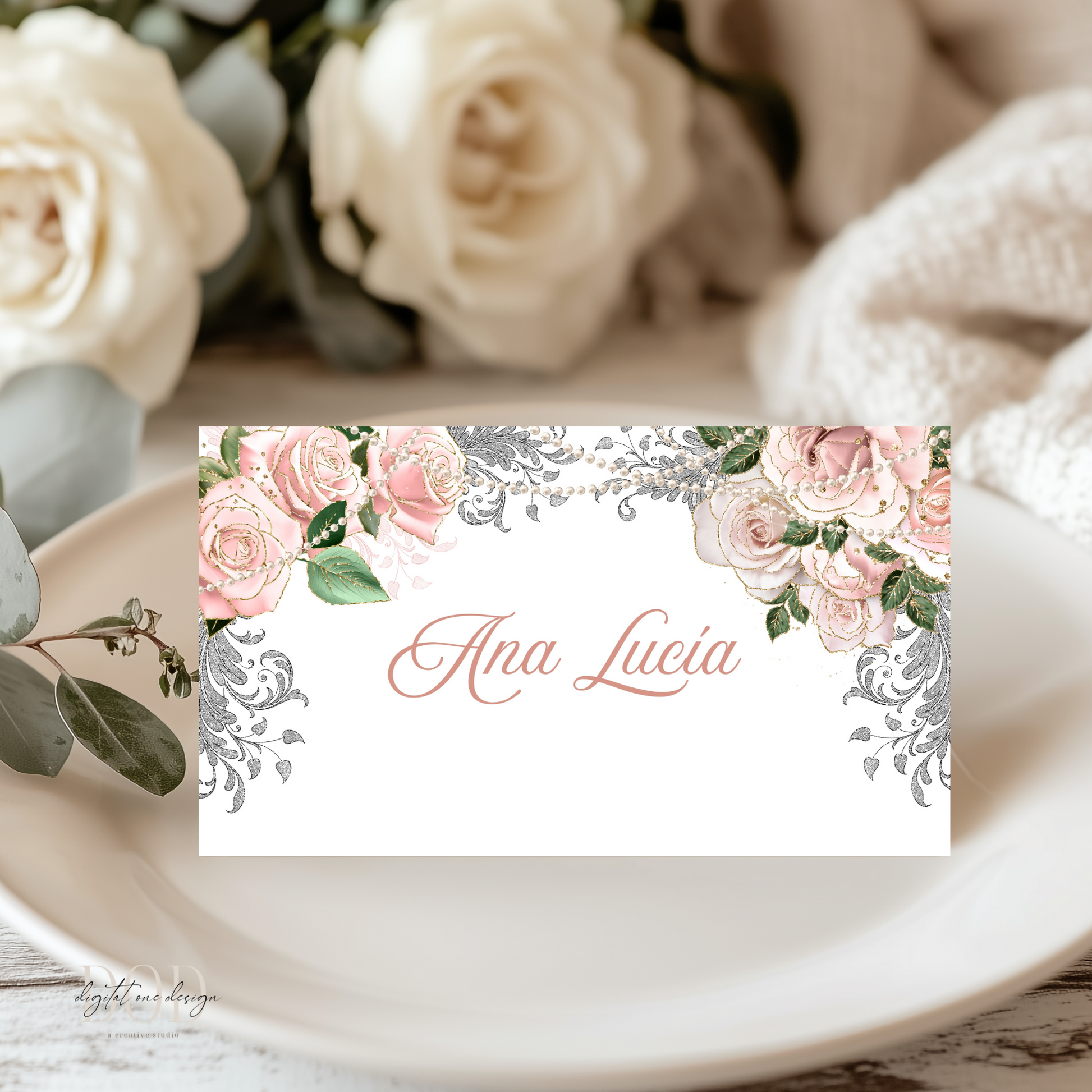 Rose Gold Floral and pearls name card with 'Ana Lucia' on a table setting with roses.