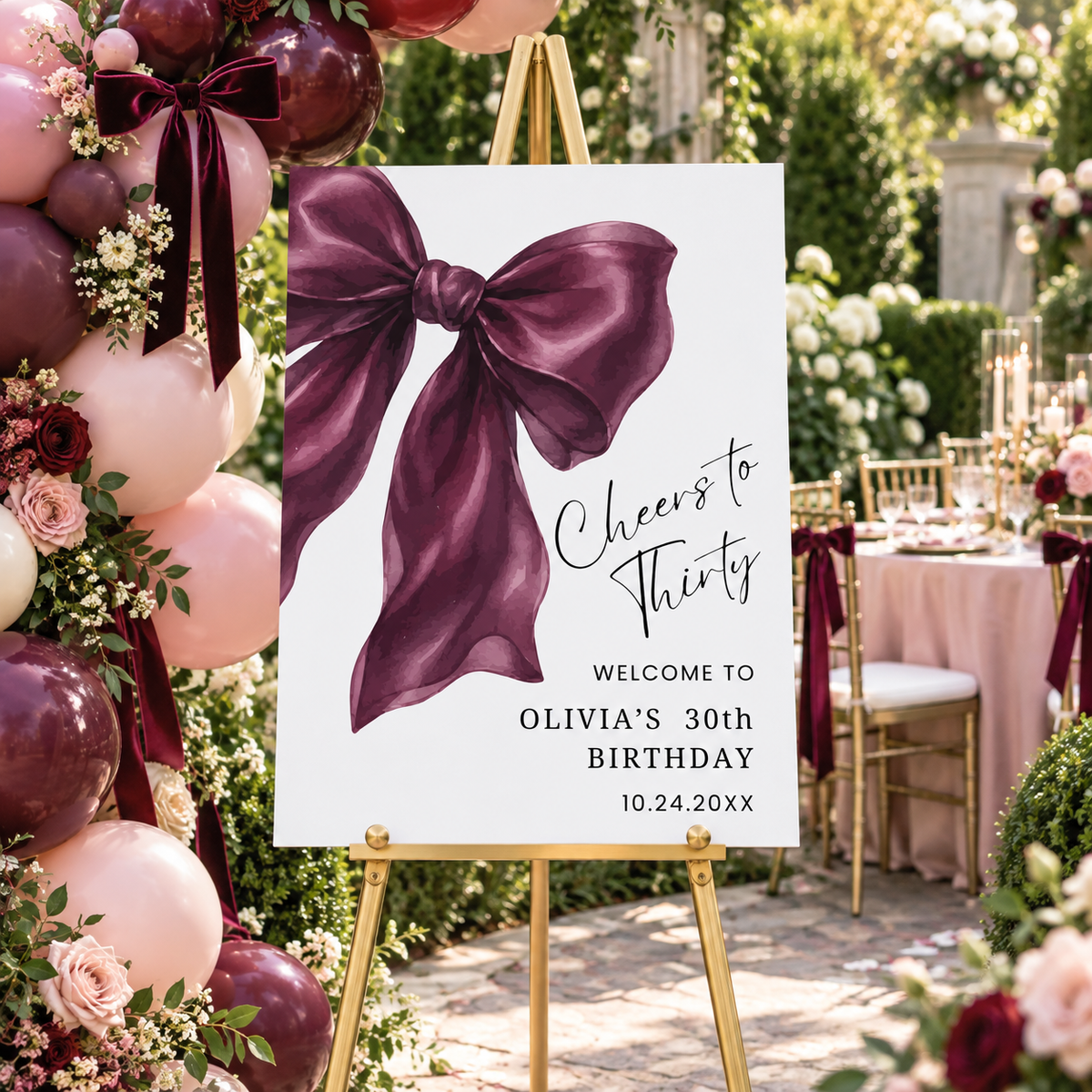 Elegant Burgundy Coquette Bow Birthday Welcome Sign for Olivia's 30th birthday party in a beautiful garden setting.
