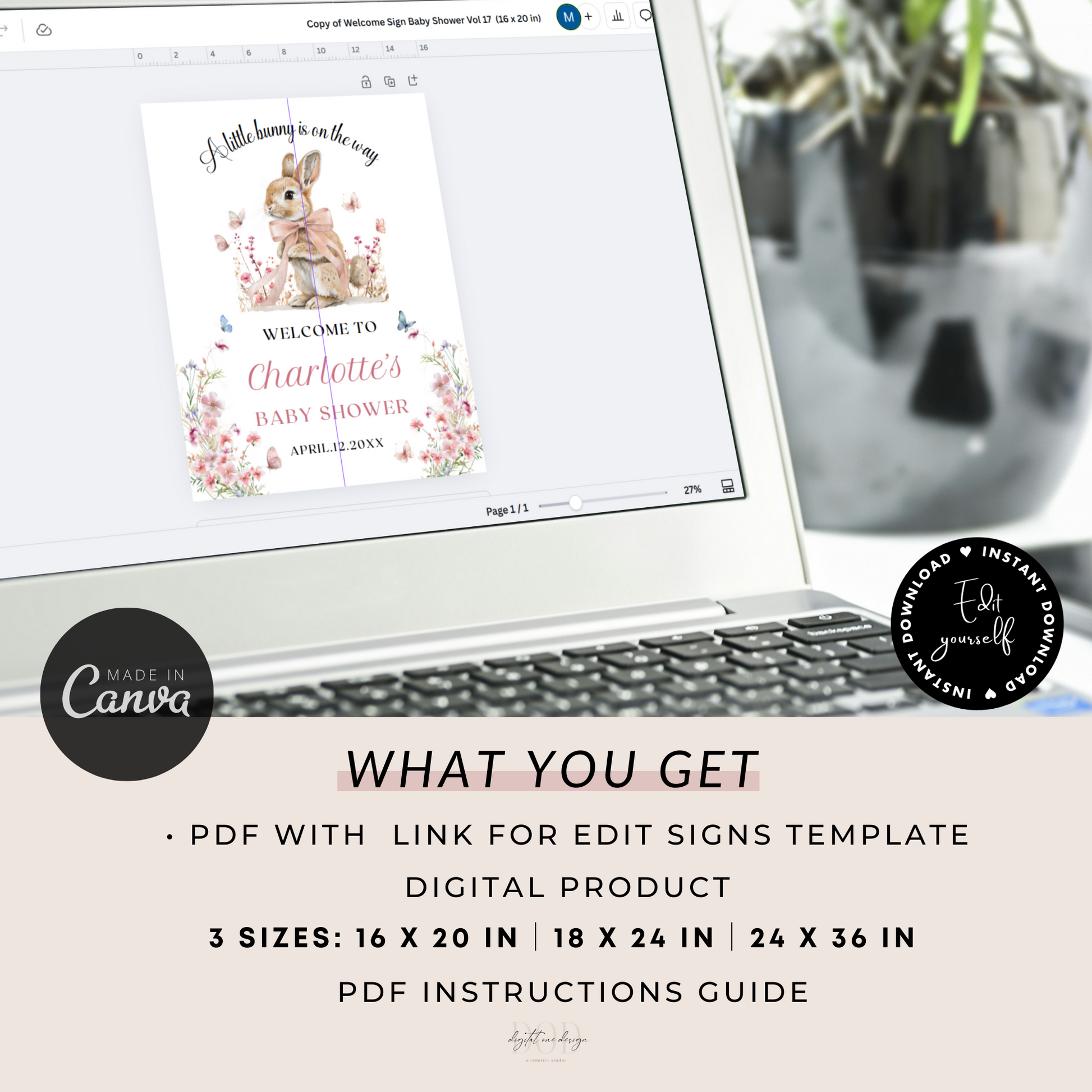 Laptop displaying a baby shower sign template with a rabbit illustration, surrounded by decorative elements.