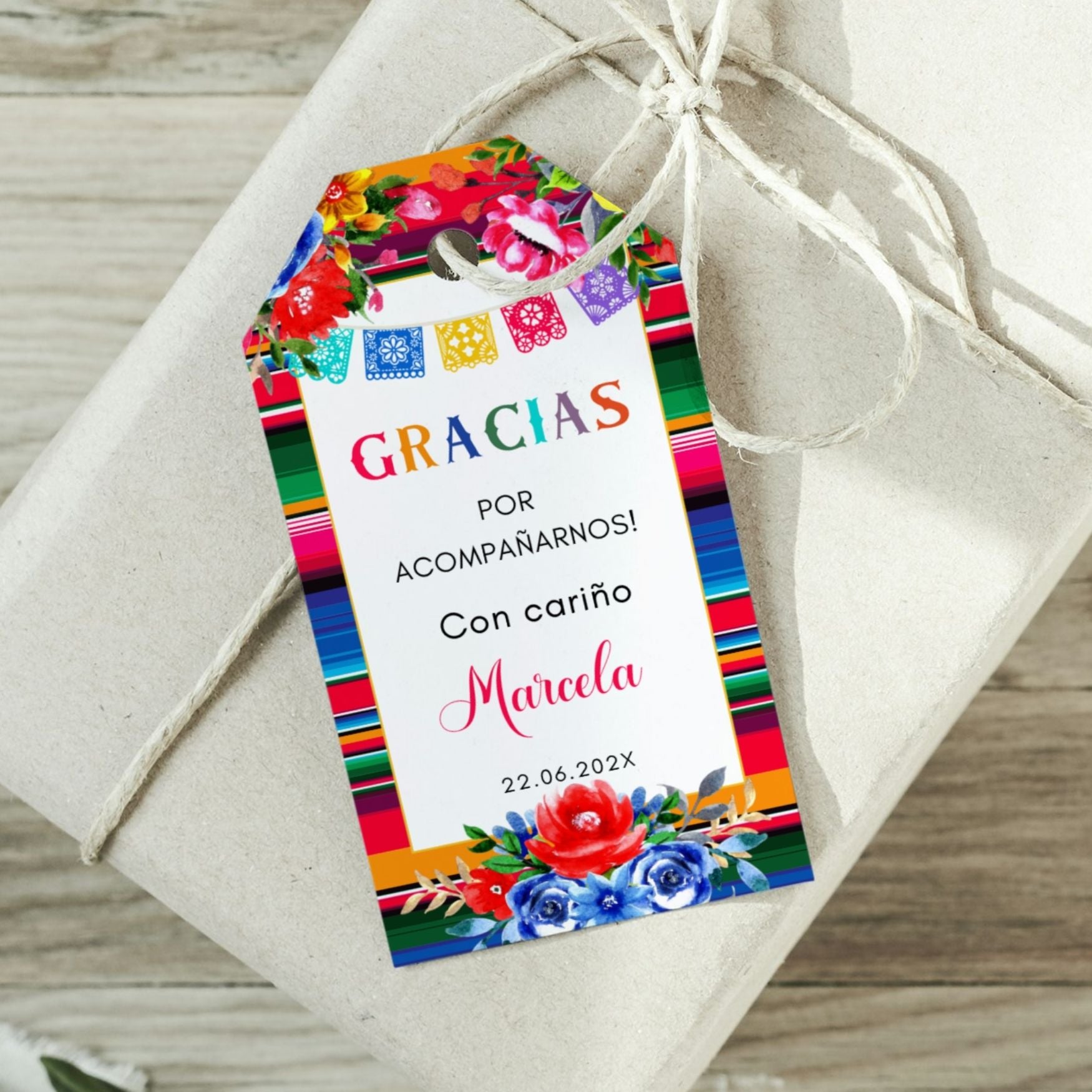 Spanish Thank you Gift tag with colorful floral ans Serape design and text on a wrapped gift.