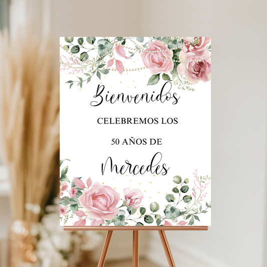 Decorative sign with floral design and text on an easel against a neutral background