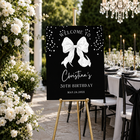 Elegant Coquette White Bow Diamonds Welcome Sign Template displayed at a birthday celebration with floral decor.