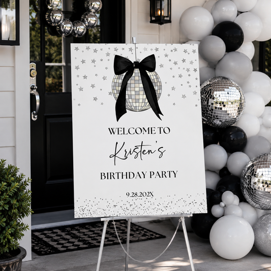 Coquette Black Bow Disco Ball Birthday Party Welcome Sign displayed at an event entrance with balloons and disco balls.