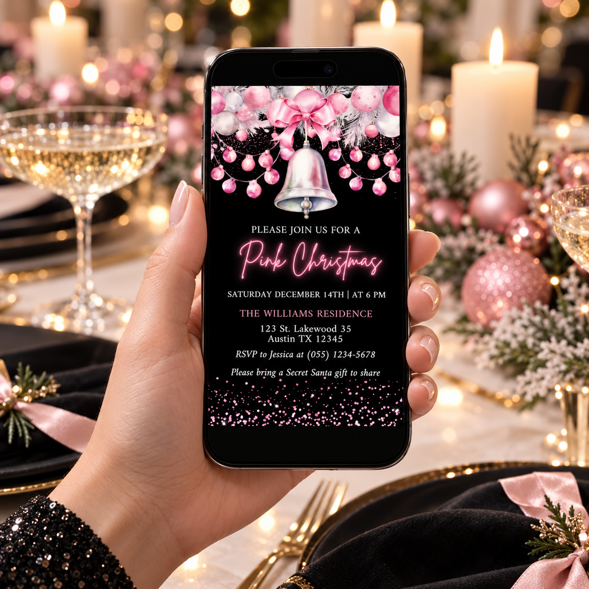 Digital Chic Pink Christmas Party Invitation displayed on a phone at a festive table setting for a holiday celebration.