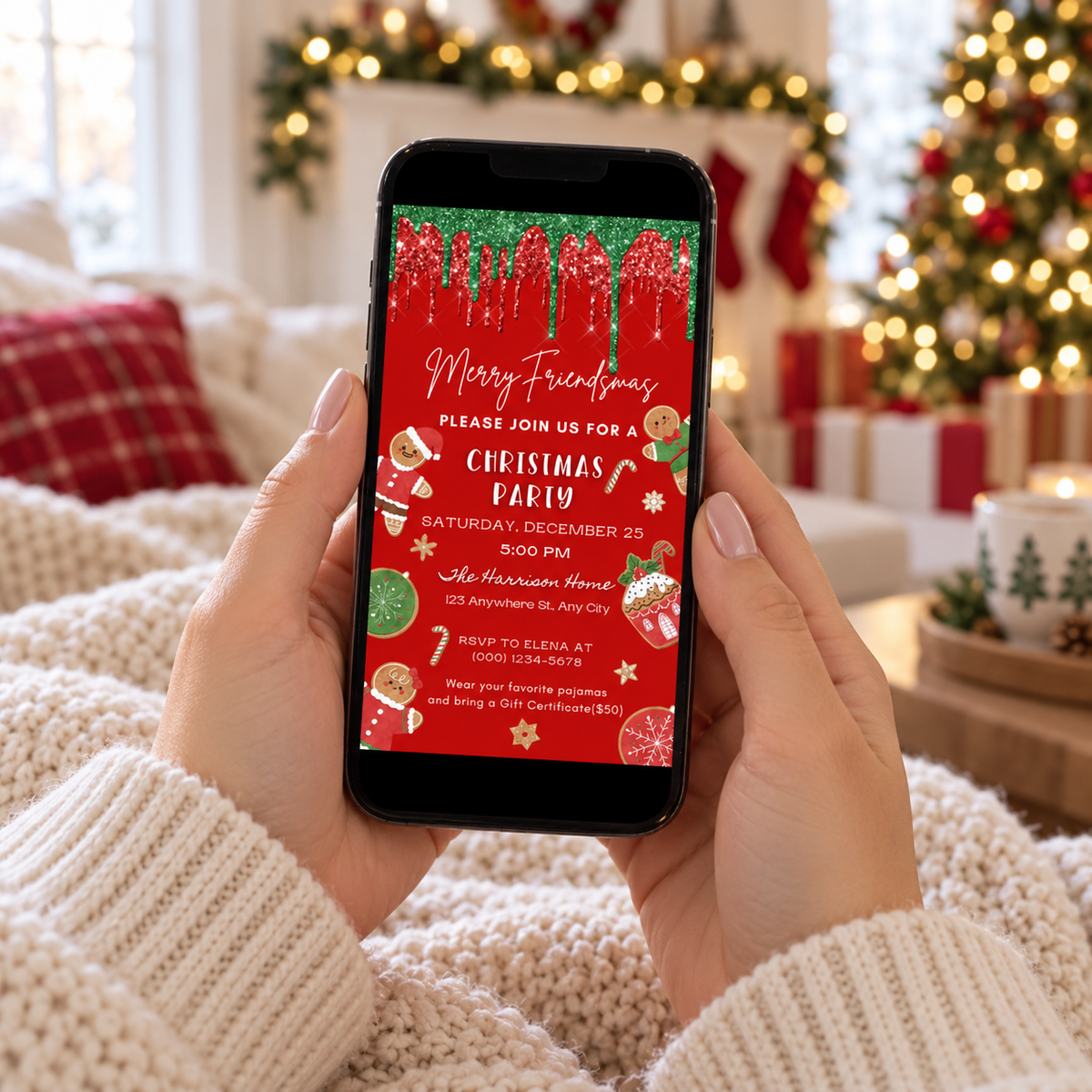 Gingerbread Friendsmas party invitation displayed on a smartphone with festive Christmas decorations in the background.